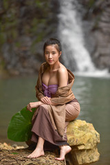 Wall Mural - Asian women wear traditional Thai, vintage style, Thai female culture river.