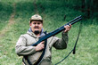 © Vadym Sarakhan - Hunter with a gun. Standing in the forest and waiting for prey