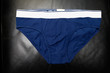 blue underpants for men on black background, isolated