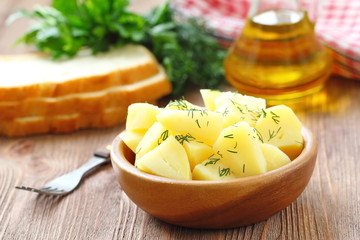 Boiled potatoes with dill and oil