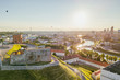 Beautiful summer panorama of Vilnius with hot air balloons in the sky, taken over the Gediminas hill, drone aerial view