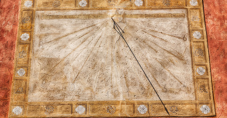 in italy sundial and   antique  wall