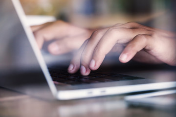 Poster - close-up finger typing on laptop keyboard see through glass