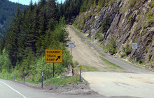 Road Sign For Runaway Truck Ramp In The Forest On A Mountain Road, Designed To Slow Down A Vehicle And Help Prevent Accidents If A Commercial Truck Loses Braking Or Loses Control Down A Steep Hill.