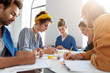 © wayhome.studio  - Portrait of five students of different races preparing for lessons at university making notes on papers reading many books, working on collaborative project. Friendship and togetherness concept.