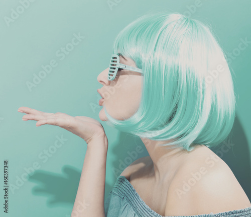 Beautiful woman in a bright blue wig
