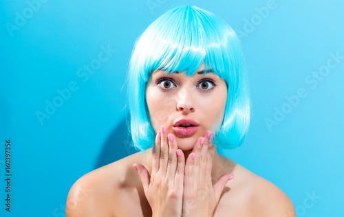 Beautiful woman in a bright blue wig