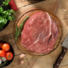 Wall Mural - Raw beef tenderloin with ingredients for cooking healthy food