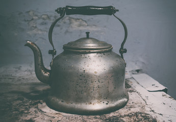 Old metal kettle on stove