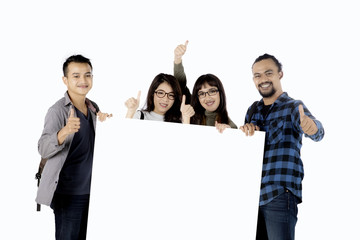 multiethnic students with empty banner