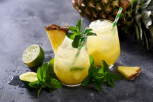 Cold Pineapple Drink With Crushed Ice, Lime And Mint