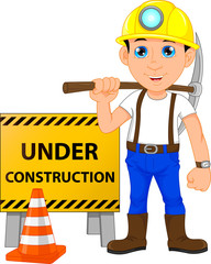 young construction worker with under construction sign