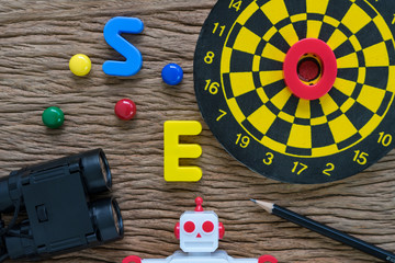 Aufkleber - seo search engine optimization concept with pencil, dartboard, magnifying glass, robot and alphabets