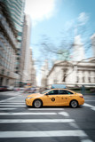 Fototapeta Miasta - Fast New York Taxi Cab driving through Manhattan