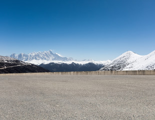 Poster - empty asphalt road with snow mountain