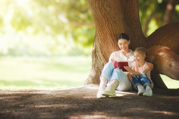 Sticker - mom reading a book to her child