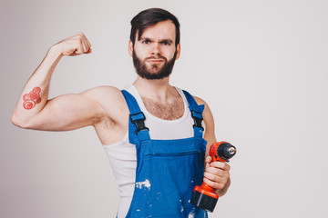 unshaved man with paint roller