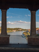 Glimpse Of River Ticino In Pavia Through The Openings Of Ponte Coperto