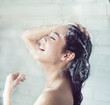 © torwaiphoto - Asian women bathing and she was bathing and washing hair.she is happy