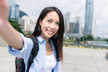 Canvas Print - Woman taking selfie with mobile phone in Hong Kong