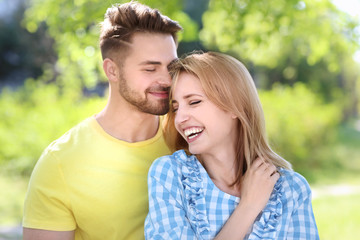 Canvas Print - Happy young couple in park on spring day