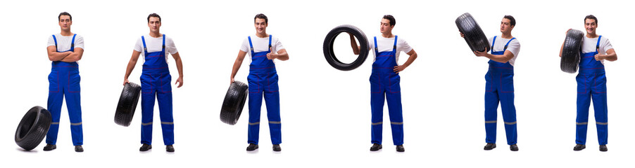 Handsome tyre repairman isolated on white