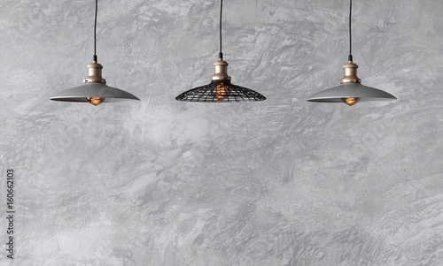 Pendant Lamps In Loft Style Against Rough Wall With Gray