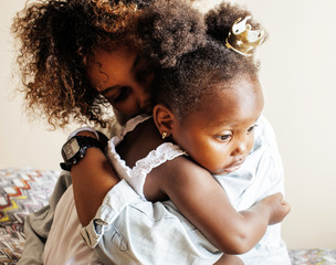 adorable sweet young afro-american mother with cute little daugh