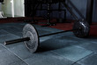 © mirage_studio - Barbell on floor in gym
