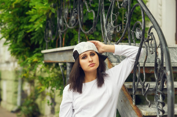 Wall Mural - Fashion model on the street. Beautiful young woman in stylish summer clothes