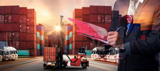 Double exposure of Businessman in a suit signing or writing a document in front Industrial Container Cargo freight ship for Business Insustrail Logistic Import Export concept