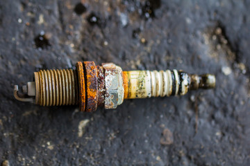 Close up Sparking plug old and dirty with rust.