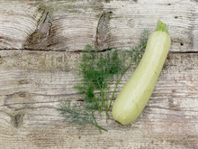Fresh Organic Zucchini On Old Wooden Background