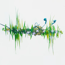 Headphones With A Sound Wave Silhouette Made From Flowers And Blades Of Grass