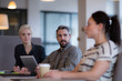 © ReeldealHD images - Businessman listening to female coworker in a meeting