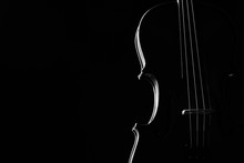 Violin Classical Music Instrument Close-up. Stringed Musical Instrument Violin Isolated On Black Background With Copy Space. Classical Orchestra Instruments Fiddle Close Up