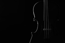 Violin Classical Music Instrument Close-up. Stringed Musical Instrument Violin Isolated On Black Background With Copy Space. Classical Orchestra Instruments Fiddle Close Up