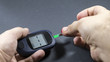 © Solidasrock - checking blood glucose for treatment studio image