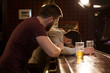 © Drobot Dean - Young man helping his drunk friend