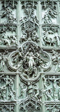 Wall Mural - Close view of one of the beautiful gates of the milan cathedral