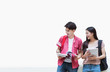 © torwaiphoto - Asian students are reading books. at the university library.white background