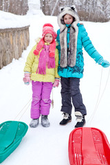 Wall Mural - Winter walk with children sled