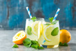 © Sunny Forest - Lemonade or mojito cocktail with lemon and mint, cold refreshing drink or beverage with ice.
