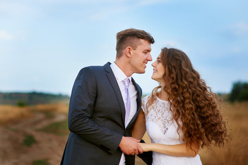 Wall Mural - Groom kissing bride on their wedding day