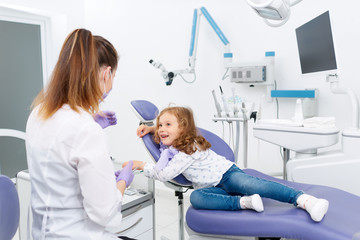 Wall Mural - Little patient and dentist in cabinet