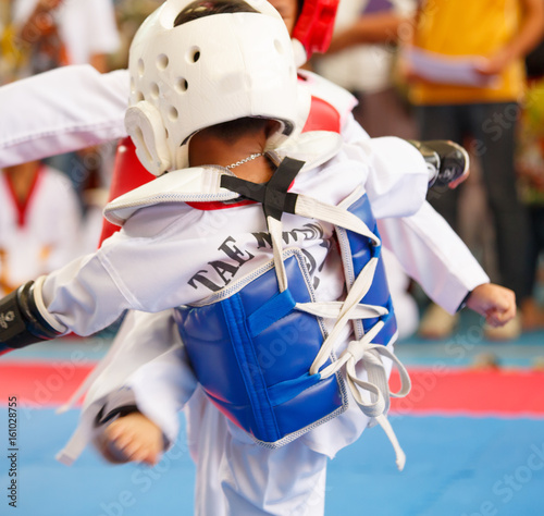 Принти на полотні Kids fighting on stage during Taekwondo contest