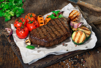 Poster - Beef grilled steak with grilled vegetables close up