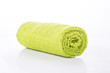 Green towel roll on white background