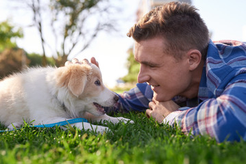 Cute portrait of puppy with owner