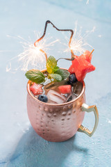 Wall Mural - Patriotic Moscow Mule cocktail with watermelon and blueberry